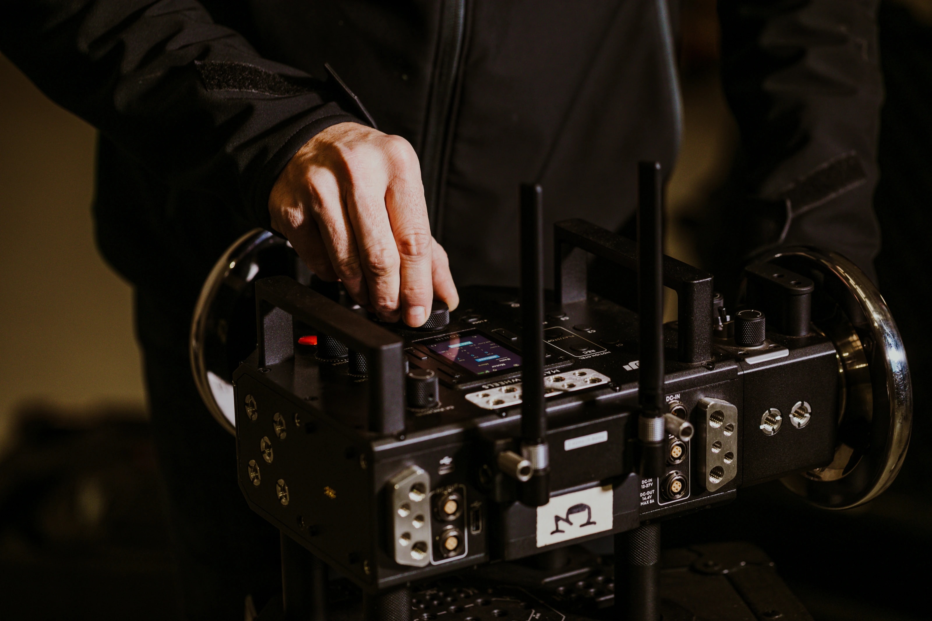A CFS Grip technician preparing a stabilized head on set